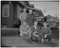 Foreign students at their new home, International Center, pictured with Austin Walter (in suit) foreign students' counselor, March 1953