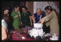 Chris Jensen and others cutting wedding cake, Corvallis, Oregon, December 1968