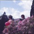 Posing with balloons and flowers near the Memorial Union