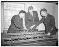 Two cadet officers in the engineers unit learn about construction of a Bailey bridge from Lieut. William W. Pearce (right), October 17, 1950