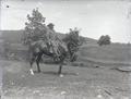 Man in a suit on a horse