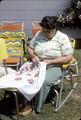 Pictures of Mrs. Shalduha embroidering, showing how the sleeve will look on her arm.