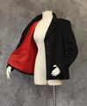 Jacket of black cashmere with notched collar and long sleeves with single button closure at wrist vent