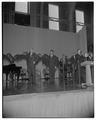 President Strand, Vice-President Richard Nixon and others singing on stage at the OSC Coliseum, October 26, 1954