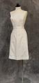 Apron of white cotton with 1 3/4" waistband with button closures at back