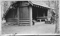 Man outside Adirondack shelter