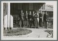 Civilian Conservation Corps men standing outside headquarters