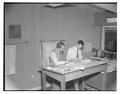 Bob Adams, (right) draftsman for the CH2M Engineering firm