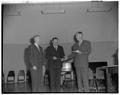 Lloyd Carter Teaching Awards of $100 each are presented by President Strand to Dr. J. J. Brady, Physics, and A. D. Hughes, Engineering, 1949