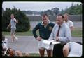 Rugby coach Murray Dawson talking with team, circa 1965