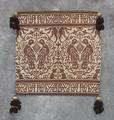 Cushion Cover of brown and natural linen in an ornate design with bird figures and animals