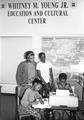 Gloria Phillips and children at Whitney Young Education and Cultural Center