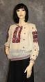 Blouse of white cotton gauze with colorful embroidery in reds, blue, violet, green and black