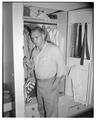 Student posing in a bedroom of the new men's residence co-op, September 1954