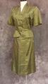 Skirt suit ensemble of olive green nylon with diagonal check print composed of ivory squares and black lines