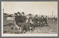 OAC baseball players sitting on a bench, circa 1910