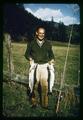 Dr. Thomas G. Scott holding two fish, circa 1965