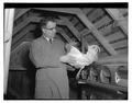 Paul Bernier, professor of poultry, holding a rooster