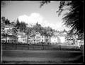 Houses in residential section, Portland Heights. Empty baseball field in foreground.