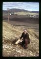 Man posing in fossil beds by high school, Fossil, Oregon, circa 1973