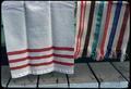 Six pieces woven on loom (L-R): yardage 24 x 32 inch nylon and wool