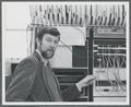 Fred Tonge posing with the PDP-11 computer