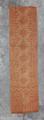 Tent Hanging fragment of pale orange and tan woven wool with a design of zig-zag creating diamonds