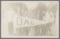 Student group posing with a large OAC pennant, 1916