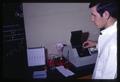 Food Science technician testing herring samples, Oregon State University, Corvallis, Oregon, circa 1965