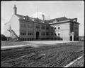 Mt. Tabor School, Portland, with unpaved street in foreground.