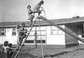 Children playing on a slide at the Oregon Ship School