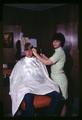 Memorial Union barber shop customer and employee, Oregon State University, circa 1969