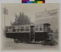 Automobile streetcar on tracks. (recto)