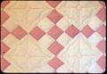 Pink and white '9 Patch' pieced by Marguerite Boentgen, 1927 or 1928 at Knoppa(?). Audrey Peters got it around 1940 at high school graduation with stipulation that Audrey Peters quilt it--she quilted in in 1972. Approximately 85 x 73 inches. $250 insured.