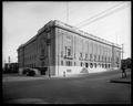 Portland Auditorium at corner of Clay and 3rd. Empty street in foreground.