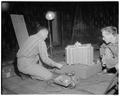 Professor Clayton and Vesta St. Clair studying wind movements, 1955