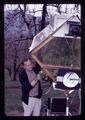 Superintendent Walt Mellenthin examining immature pears, Mid-Columbia Experiment Station, Hood River, Oregon, March 22, 1972