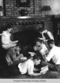 Students, Berea College, reading around the fireplace