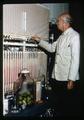 Horticulturist Dr. Elmer O. Hansen testing atmospheric conditions in pear storage, 1963