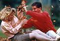 Unidentified students playing in the leaves on OSU campus, circa 1990