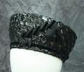 Cossack style hat of wide woven straw in shiny black with grosgrain and velour ribbon accents