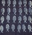 Textile panel of indigo cotton broadcloth with pattern of fish in pale blue batik
