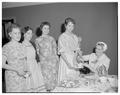 Four women at a tea party, circa 1955