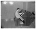 Tom Roberts playing the organ, October 22, 1953