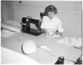 A Summer Session student works on a sewing project