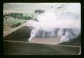 Aerial view of grass stubble burning at Ed Jenks Farm, 1965