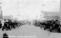 Loaded logging trucks in town