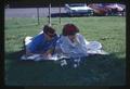 Students studying mice in cage outside, 1965