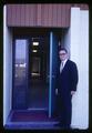 Man outside office building, circa 1965