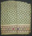 Textile fragment from a sleeve or pant leg of green cotton gauze